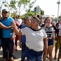 Residents of La Concepcion village, in Acapulco municipality, Guerrero state, Mexico, are in the street after a series of clashes among members of the Regional Coordinator of Community Authorities (CRAC), civilians and police left at least 11 dead Sunday. | AFP-JIJI