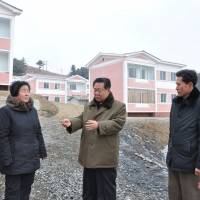 Top North Korean official Choe Ryong Hae gestures during a visit to a completed cosmetics factory and cooperative farm in Sinuiju, in this photo released Tuesday. | REUTERS