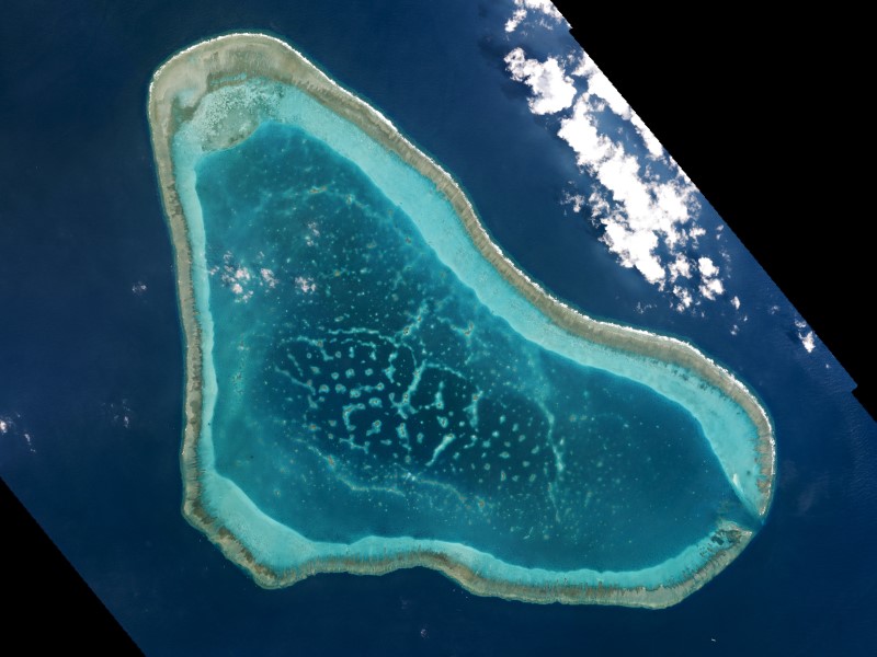 Scarborough Shoal, in the South China Sea, is seen in this photo taken in March 2016. | PLANET LABS / VIA REUTERS