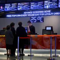 People buy tickets inside the Cinema City complex in downtown Beirut Tuesday. | AP