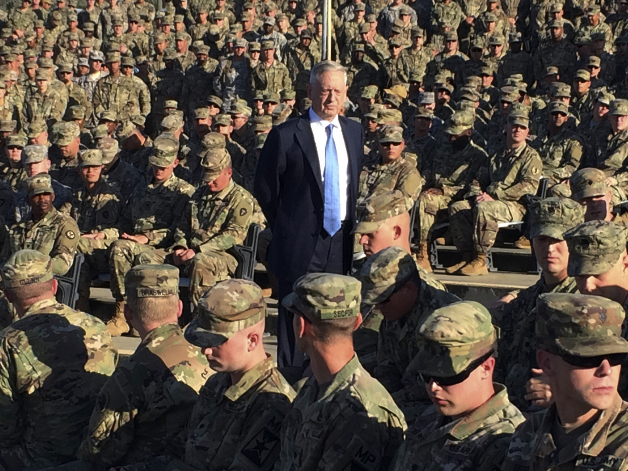 Defense Secretary Jim Mattis talks to troops at an outdoor movie theater at Guantanamo Bay, Cuba, on Dec. 21. The unannounced visit was the first by a defense secretary since Donald Rumsfeld visited in January 2002 shortly after the first prisoners arrived from Afghanistan. | AP