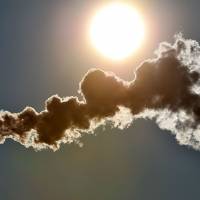 Smoke spews from a chimney in a winter sky in Seclin, northern France, in 2012. The last three years were the hottest on record, the United Nations weather agency said Thursday, citing fresh global data underscoring the dramatic warming of the planet. | AFP-JIJI