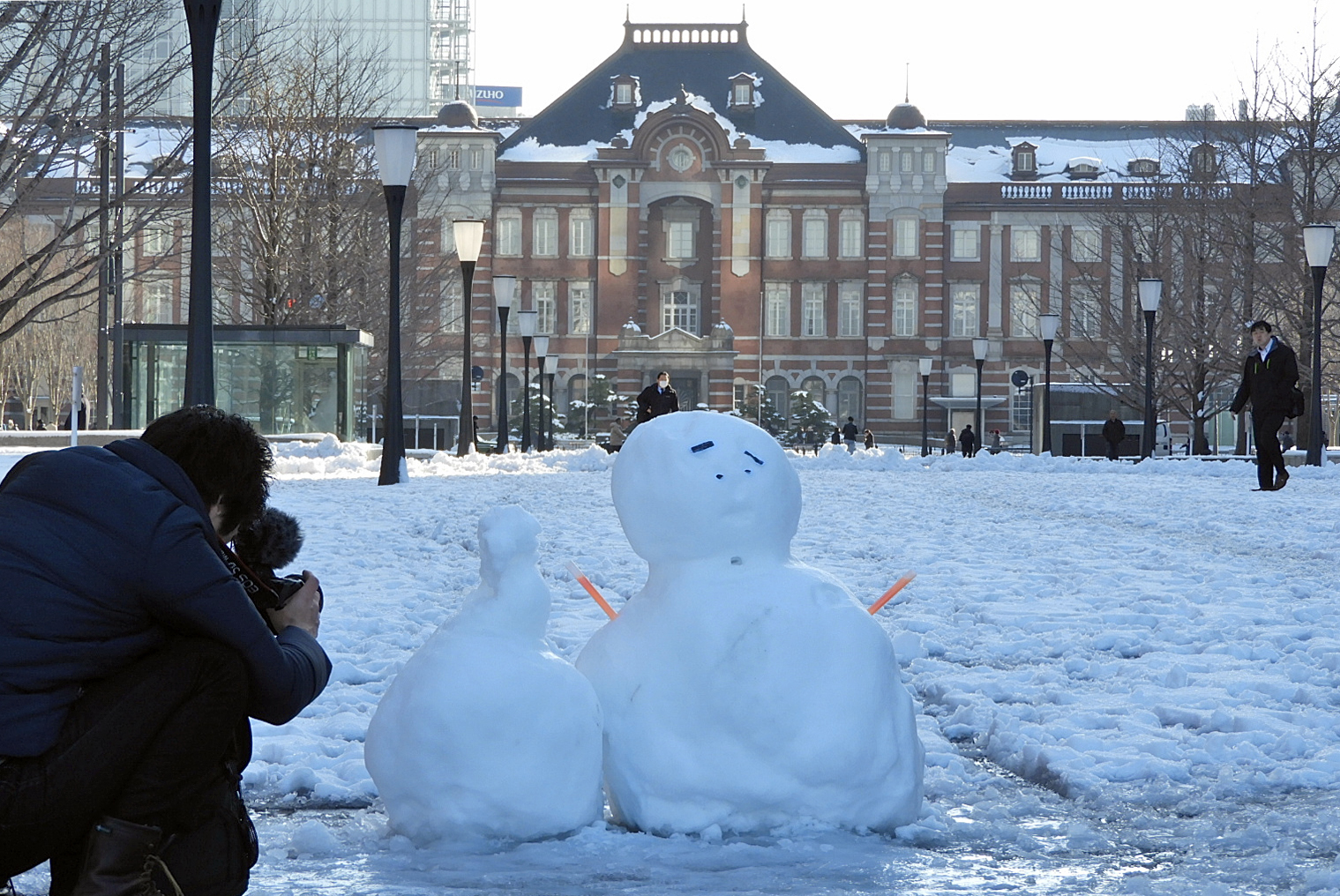 A snowman is seen near Tokyo Station on Tuesday, a day after the capital saw its heaviest snowfall in four years. | YOSHIAKI MIURA