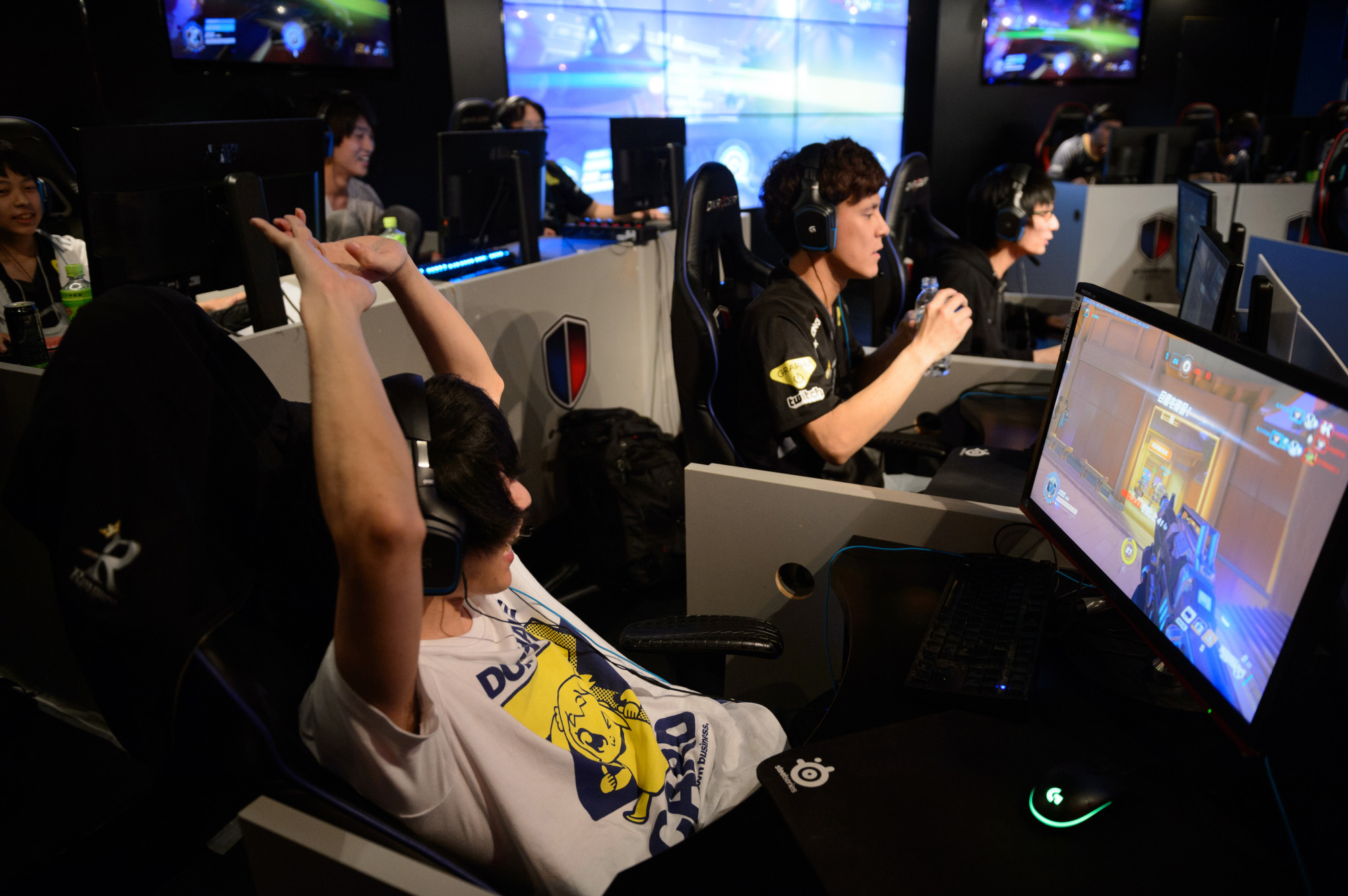 Gamers participate in the AOC Open esports event in Tokyo last July. | BLOOMBERG