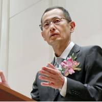 Shinya Yamanaka, who heads Kyoto University\'s iPS institute, delivers a speech in Kyoto on Wednesday. | KYODO