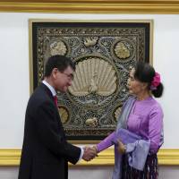 Myanmar\'s State Counselor and Foreign Minister Aung San Suu Kyi shakes hands with Foreign Minister Taro Kono after their joint press conference at the Ministry of Foreign Affairs in Naypyitaw, Myanmar, on Jan. 12. | AP