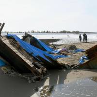 Seven bodies were found in this capsized wooden boat that washed ashore in Kanazawa, Ishikawa Prefecture, the police said Tuesday. | KYODO