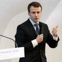 Then French Economy Minister Emmanuel Macron speaks during the 2015 presentation of the economic project within France\'s bid to host the 2025 World Expo, at the Louis Vuitton Arts Foundation in Paris. France on Sunday withdrew its bid for holding the World Expo 2025, citing financial reasons. | AFP-JIJI