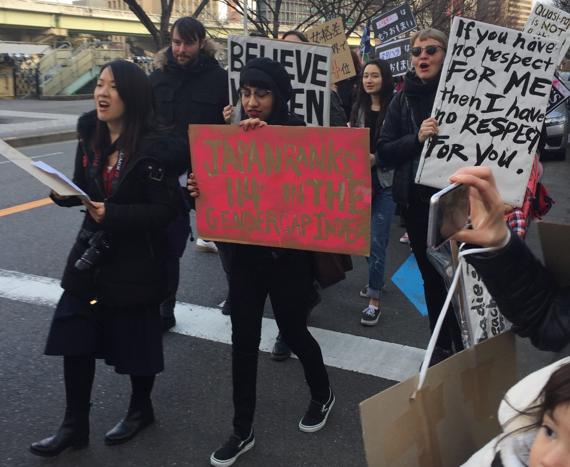 People march against U.S. President Donald Trump in Osaka on Saturday. | ERIC JOHNSTON
