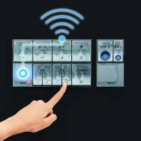 A remote controller for a new toilet, made by Toto Ltd. for public bathrooms, uses unified pictograms. | COURTESY OF TOTO LTD.