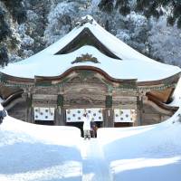 Mount Daisen\'s Ogamiyama Shrine, its steep staircase buried beneath the snow. | TAKASHI KARAKI