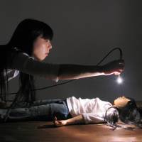 Bright lights: Artist Naoko Tanaka performs in an installation titled \"The shine thrower\" in Berlin, January 2011. | COURTESTY OF NAOKO TANAKA