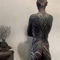 Two examples of Gakkin\'s freehand tattoo work, in which black dominates and red offers striking contrast. | GAKKIN
