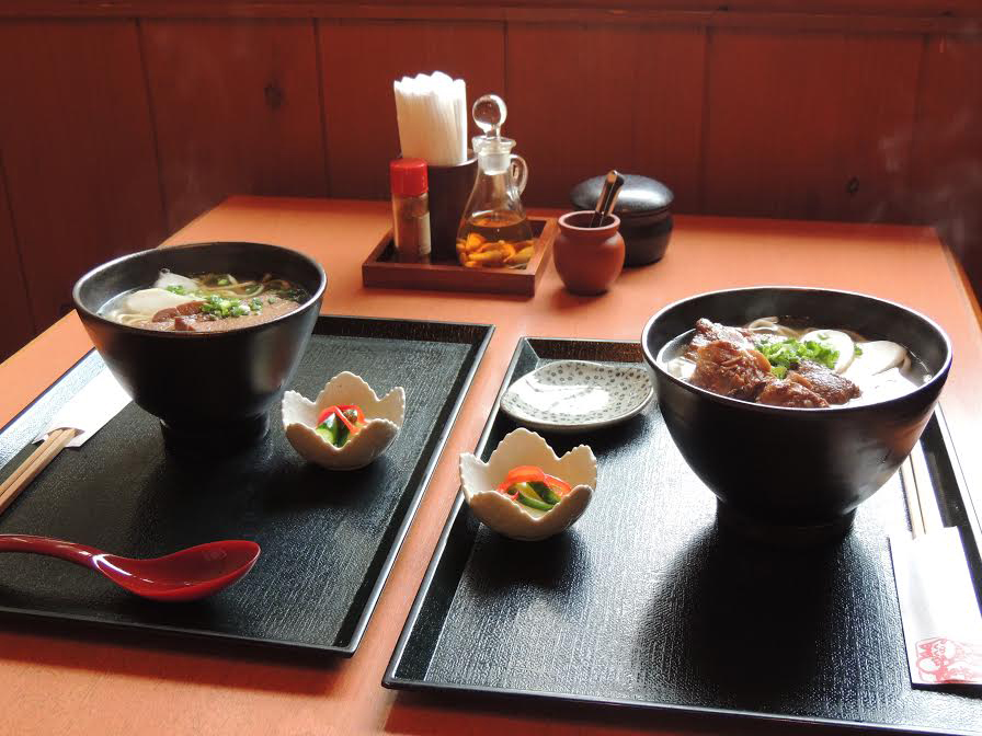 Above: Okinawa soba is finished with pickled ginger, shima-negi (green onions), kamaboko (fish cake), and sanmainiku (bonless pork ribs) or sōki (slow-stewed pork spare ribs). | DAVEY YOUNG