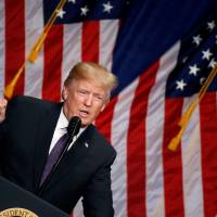 U.S. President Donald Trump delivers remarks on his national security strategy, which labels China as a \"strategic competitor,\" in Washington on Dec. 18. | REUTERS