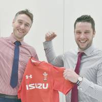 Welsh Rugby Union head of rugby participation Ryan Jones (left) and head of group sales and marketing Craig Maxwell pose for a photo in Tokyo this week. | YOSHIAKI MIURA