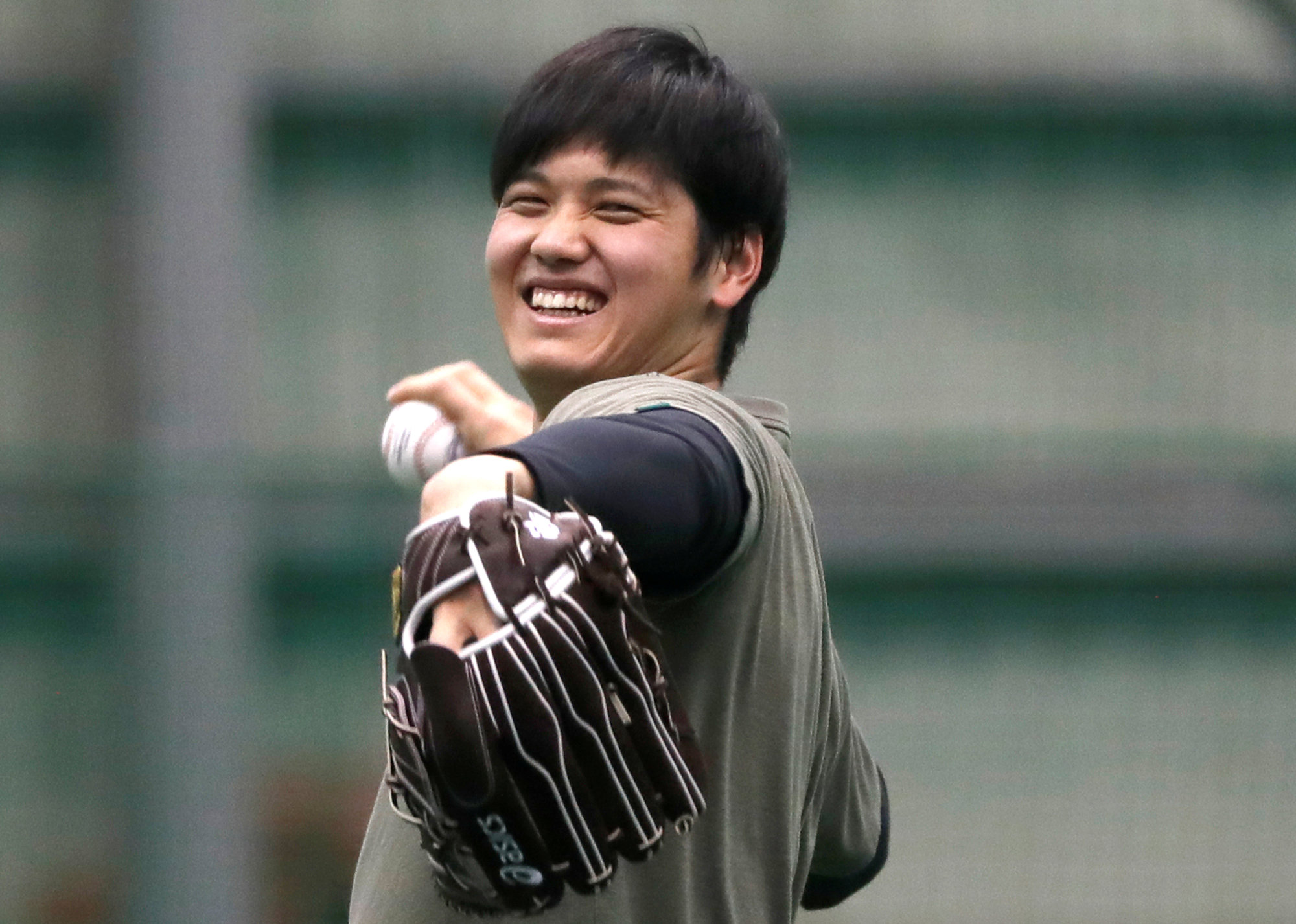 The Angels' Shohei Ohtani works out at the Hokkaido Nippon Ham Fighters' ni-gun facility in Kamagaya, Chiba Prefecture, on Friday. | REUTERS