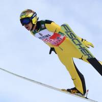 Noriaki Kasai makes a practice jump during an event in Oberstdorf, Germany, on December 29, 2017. Kasai secured his spot at an eighth straight Winter Olympics on Saturday. | AFP-JIJI