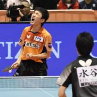 Tomokazu Harimoto celebrates after beating Jun Mizutani in the men\'s singles final at the national table tennis championships on Sunday at Tokyo Metropolitan Gymnasium. | KYODO