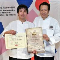 Patissier Masahiro Hashimoto (left) poses for a photograph with Shimada after being named winner of the Galette des Rois Club\'s 2017 competition. | YOSHIAKI MIURA