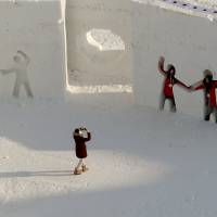 People pose for a picture ahead of the start of the Pyeongchang 2018 Games. | REUTERS