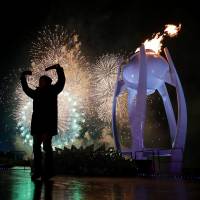 Fireworks erupt as the cauldron is lit with the Olympic flame during the opening ceremony of the Pyeongchang 2018 Winter Olympic Games on Friday. | AFP-JIJI