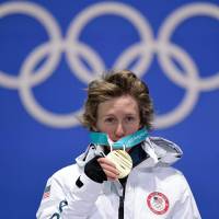 U.S. gold medallist Redmond Gerard poses on the podium during the medal ceremony for the snowboard men\'s slopestyle on Sunday. | AFP-JIJI