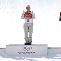 Silver medallist Max Parrot of Canada, gold medallist U.S. Redmond Gerard and bronze medallist Canada’s Mark McMorris celebrate during the victory ceremony at the end of the men\'s snowboard slopestyle.  | AFP - JIJI
