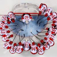 Olympic athletes from Russia huddle before their match against Canada in a Preliminary Round Match. | REUTERS