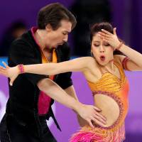 Kana Muramoto and Chris Reed of Japan compete in the Ice Dance team figure skating event at the Gangneung Ice Arena. | REUTERS