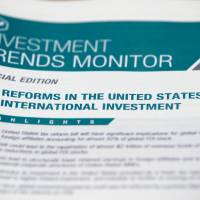 A press release on tax reform in the U.S. is pictured during a press conference of the United Nations Conference on Trade and Development (UNCTAD) in Geneva Monday. | REUTERS