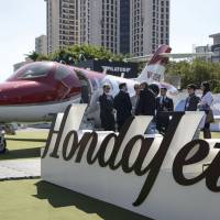 A HondaJet HA-420 is displayed at the Latin American Business Aviation Conference and Exhibition in Sao Paulo in 2015. Honda Aircraft Co. sees major prospects in China and Southeast Asia as wealthy individuals seek out the lightweight plane. | BLOOMBERG