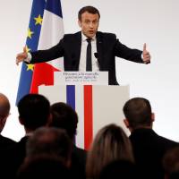 French President Emmanuel Macron delivers a speech to the young French farmers invited at the Elysee Palace before the opening of the 2018 Paris International Agricultural Show in Paris Thursday. | REUTERS