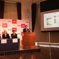 Representatives from JTB Corp., Microsoft Japan Co. and Navitime Japan Co. announce the launch of the Japan Trip Navigator app on Thursday at a hotel in Tokyo. | KAZUAKI NAGATA