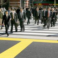 A monthly Reuters Corporate Survey shows that more than half of Japanese companies have no plans to raise wages. | BLOOMBERG
