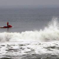 A rescue workers rides a personal water scooter during searches for the chief executive of sportswear maker Quiksilver Pierre Agnes, in Hossegor, southwestern France, Wednesday. | AP