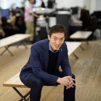 Chikahiro Terada, co-founder and chief executive officer of Sansan Inc., is seen in Tokyo on Jan. 29. Tokyo-based startup Sansan\'s software analyzes business cards so that people can discover who within a company knows whom. | BLOOMBERG