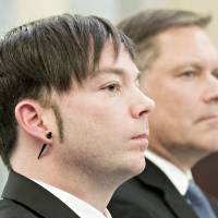 John Flynn (left), chief information security officer of Uber Technologies Inc., and Marten Mickos, chief executive officer of HackerOne Inc., listen during a Senate Commerce, Science and Transportation Subcommittee hearing in Washington on Tuesday. The Senate panel is looking into a 2016 data breach at Uber Technologies and alleged company efforts to hide the cyberattack, which exposed personal information of 57 million drivers and customers, by paying off hackers. | BLOOMBERG