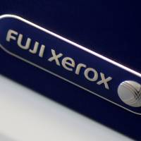 The Fuji Xerox logo is seen on a photocopier in this illustration photo Jan. 19. | REUTERS