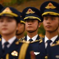Members of a military honor guard rehearse ahead of a welcome ceremony for British Prime Minister Theresa May in Beijing\'s Great Hall of the People on Jan. 31. | AFP-JIJI