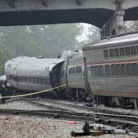 Emergency responders are at the scene after an Amtrak passenger train crashed into a freight train and derailed in Cayce, South Carolina, Sunday. | REUTERS