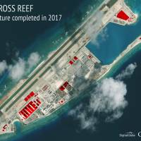 An annotated satellite image of Fiery Cross Reef in the Spratly island chain of the South China Sea shows areas where China has conducted construction work above ground during 2017. | CSIS ASIA MARITIME TRANSPARENCY INITIATIVE/DIGITALGLOBE / VIA AP