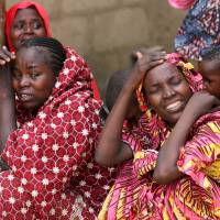 Relatives of missing schoolgirls react in Dapchi in the northeastern state of Yobe, after an attack on the Nigerian village by Boko Haram Friday. | REUTERS