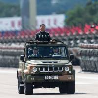 Chinese President Xi Jinping inspects People\'s Liberation Army soldiers at a Hong Kong barracks last June. | AFP-JIJI