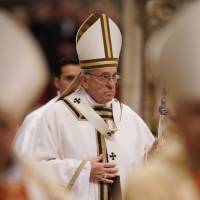 Pope Francis leaves at the end of a Mass with members of different religious orders in St. Peter\'s Basilica at the Vatican on Friday. | AP
