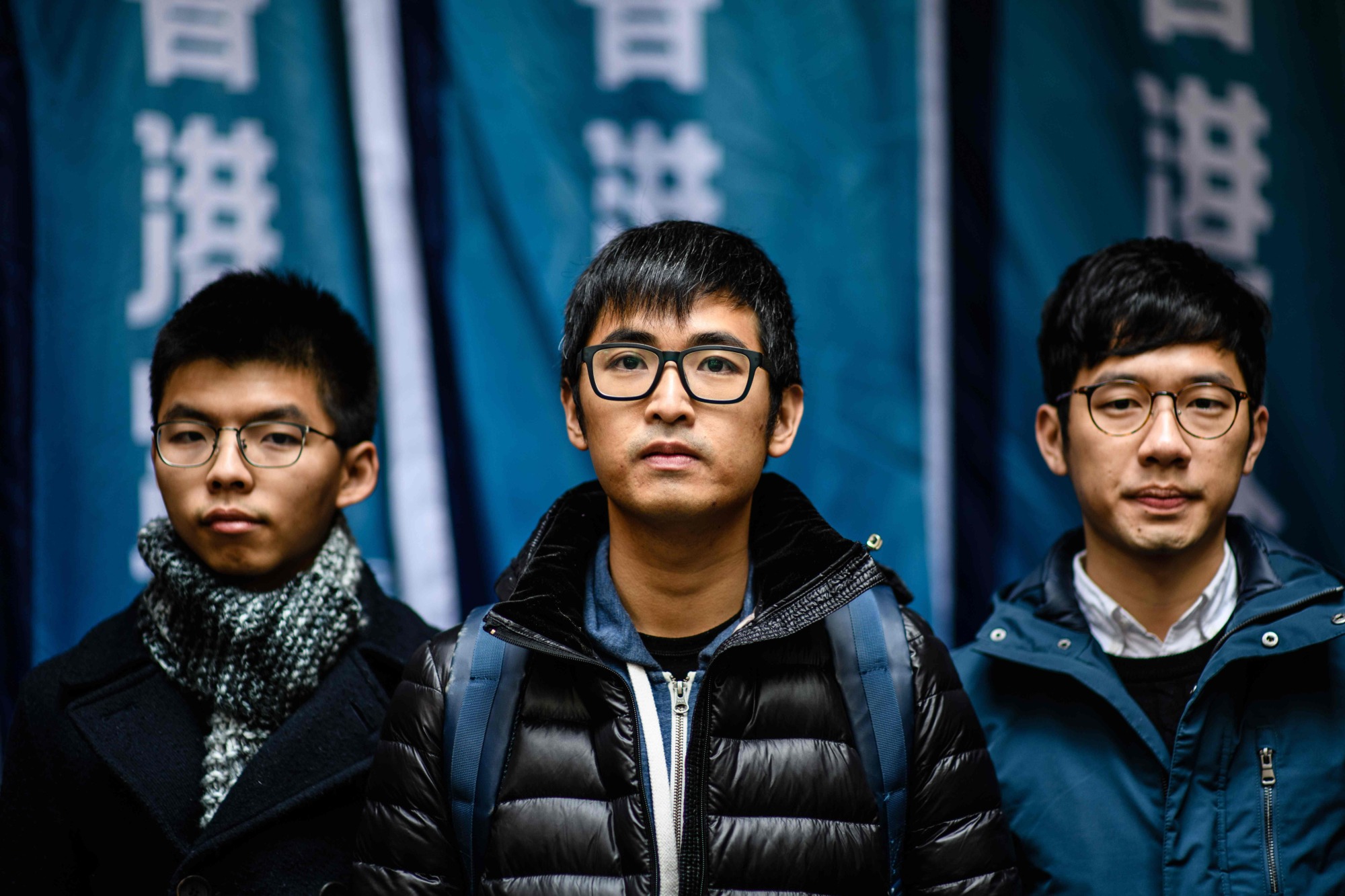 Hong Kong's leading democracy activists (from left to right) Joshua Wong, Nathan Law and Alex Chow arrive outside the Court of Final Appeal in Hong Kong on Tuesday. | AFP-JIJI