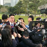 Pro-independence activist Andy Chan speaks to journalists in Hong Kong on Tuesday. | REUTERS