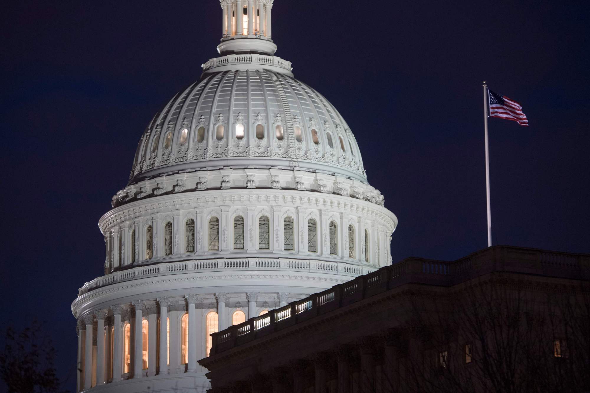 The U.S. Capitol is seen at dusk in Washington on Tuesday. The U.S. House of Representatives on Tuesday approved another stopgap bill to keep the federal government from shutting down. | AFP-JIJI