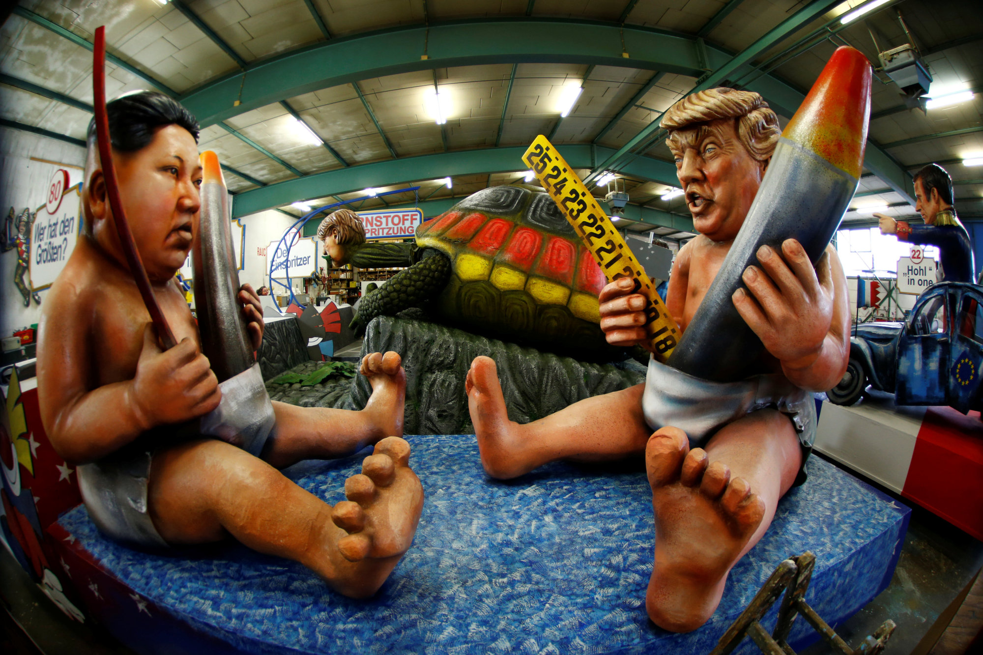 A paper-mache float depicting North Korean leader Kim Jong Un and U.S. President Donald Trump is seen Tuesday during preparations for the upcoming Rose Monday carnival parade in Mainz, Germany. | REUTERS