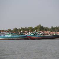 Ferries bring construction materials to Vashan Char, previously known as Thengar Char island, in the Bay of Bengal, Bangladesh, Feb. 14. | REUTERS